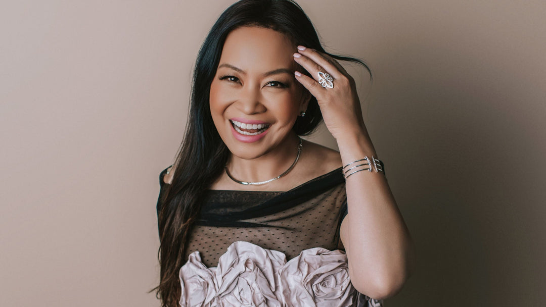 Woman in floral top wears sterling silver statement jewelry