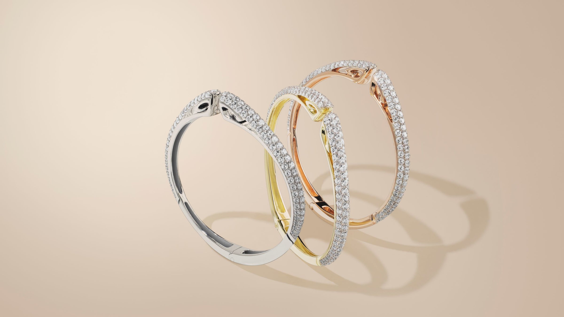 Trio of sparkling cuffs in sterling silver, 18K Gold Vermeil and 18K Rose Gold Vermeil accented with white CZ stones