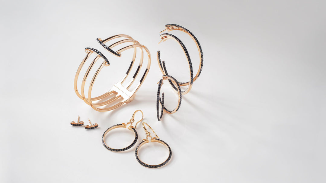 5 styles of rose gold jewelry accented with black CZ