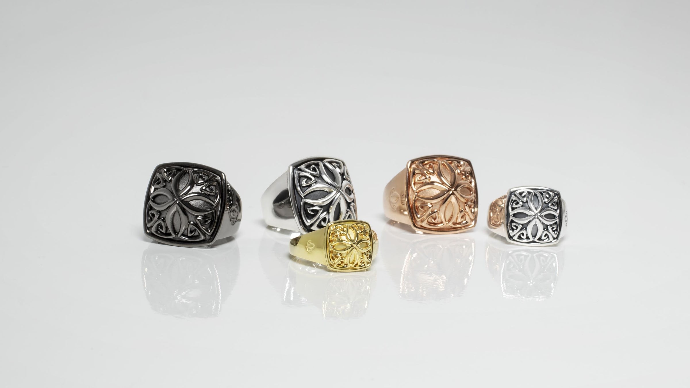 Array of Insignia signet rings in silver and gold