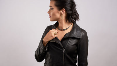 Woman in leather jacket wearing black ruthenium vermeil jewelry from REALM