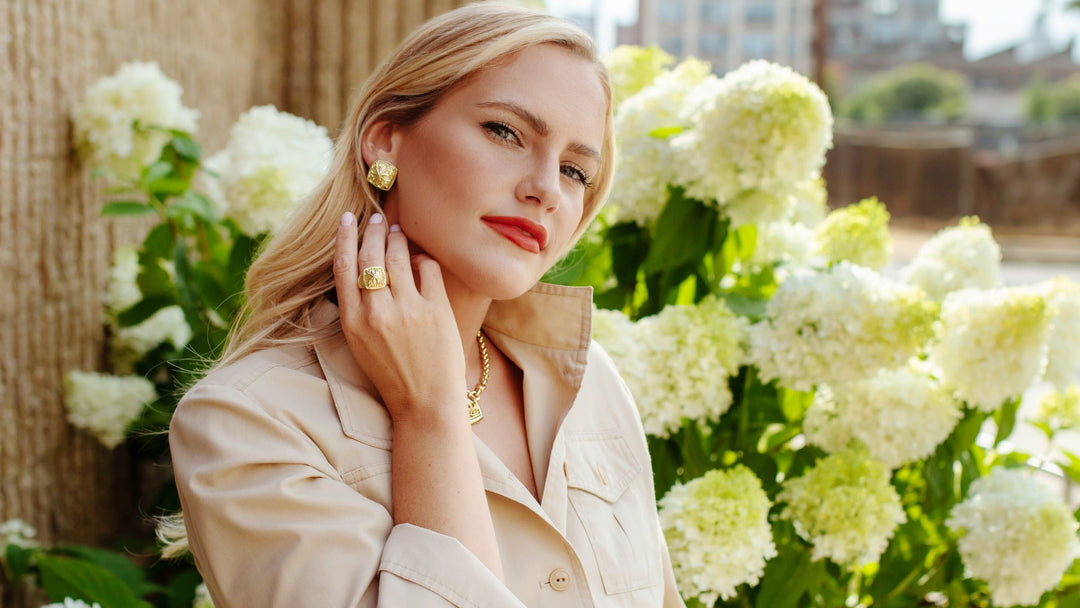 Vic wears portrait hoop earrings from the 18K Gold Vermeil collection from REALM