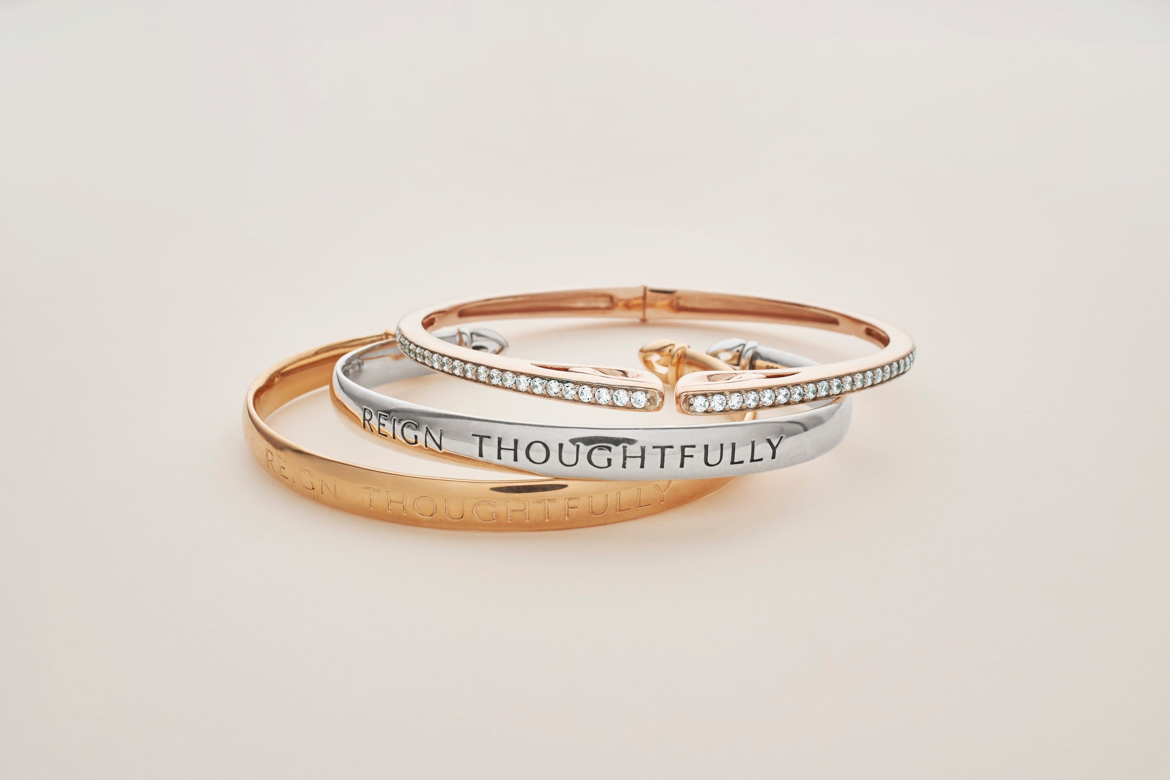 Trio of cCuff bracelets in sterling silver, rose gold and white CZ