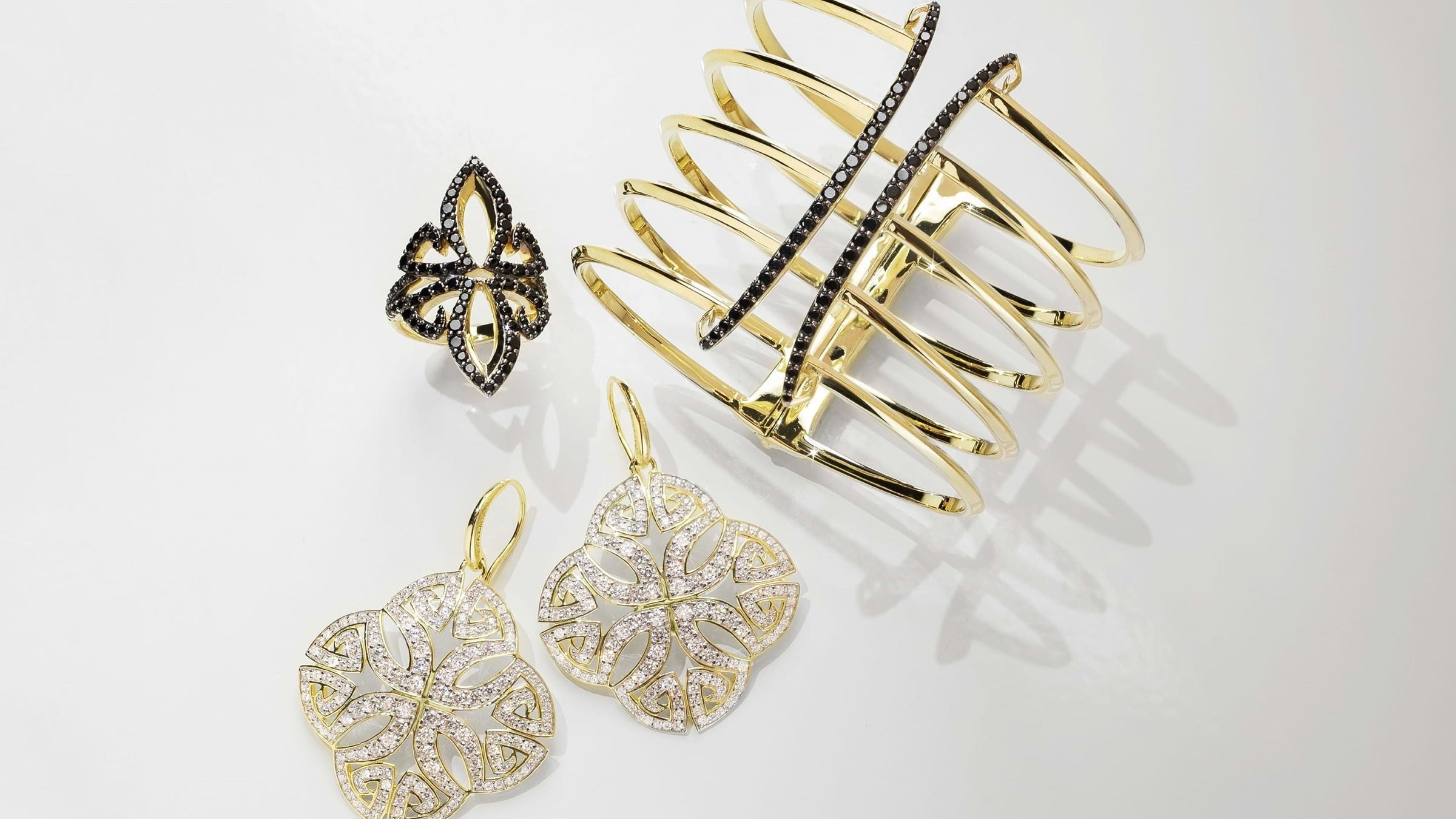 Luxurious trio of ring, earrings and cuff from REALM under $1000