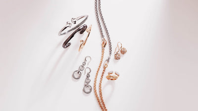 Array of silver and rose gold jewelry from REALM under $500