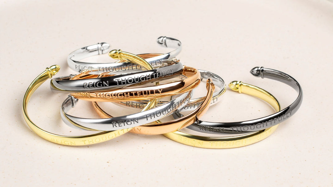 The Reign Thoughtfully Cuff Bracelet is a gentle reminder on your wrist to be both strong and kind as you reign in your realm.