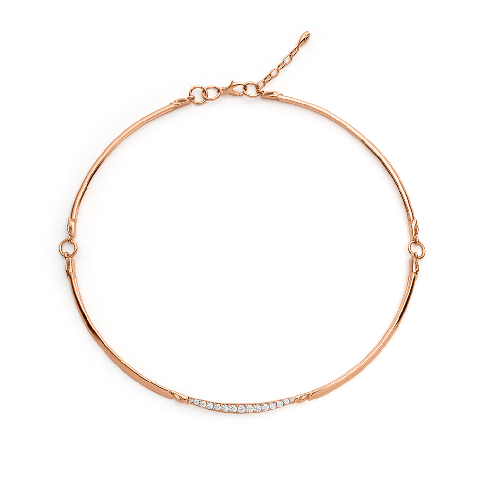 A rose gold vermeil choker necklace with a crescent shape adorned with sparkling pavé set cubic zirconia.