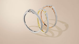 Tril of cuff bracelets in silver, gold, rose gold, each sparkling with over 150 hand prong-set white cz stones 