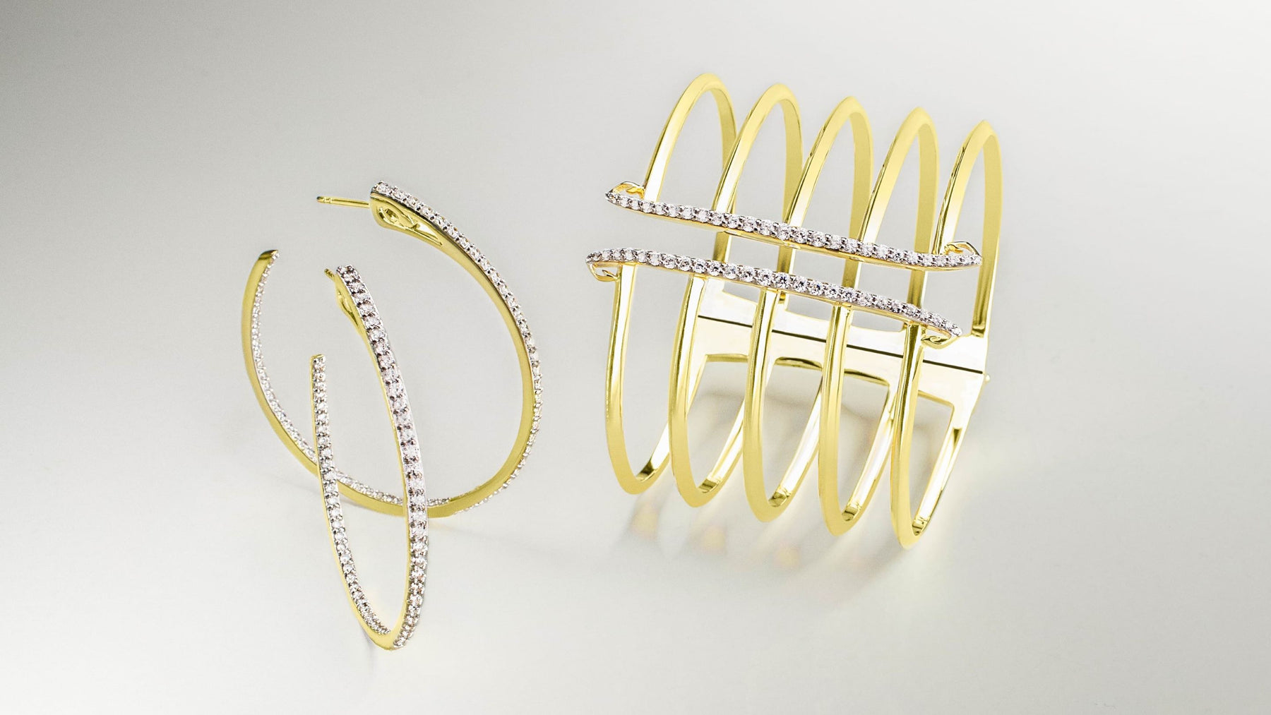 As seen on the Drew Barrymore Show: hoop earrings and corset cuff bracelet in 18K Gold Vermeil and white cz