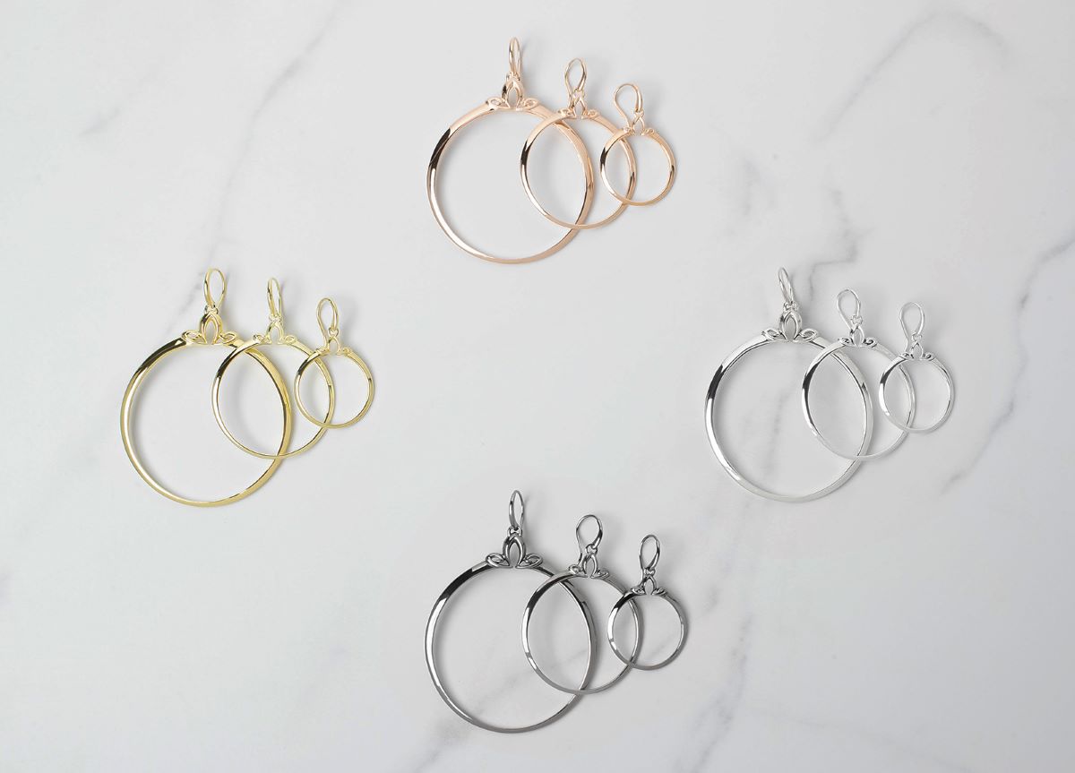 array of portrait hoop earrings in 3 silhouette sizes and 4 precious metal colors from REALM Fine + Fashion Jewelry