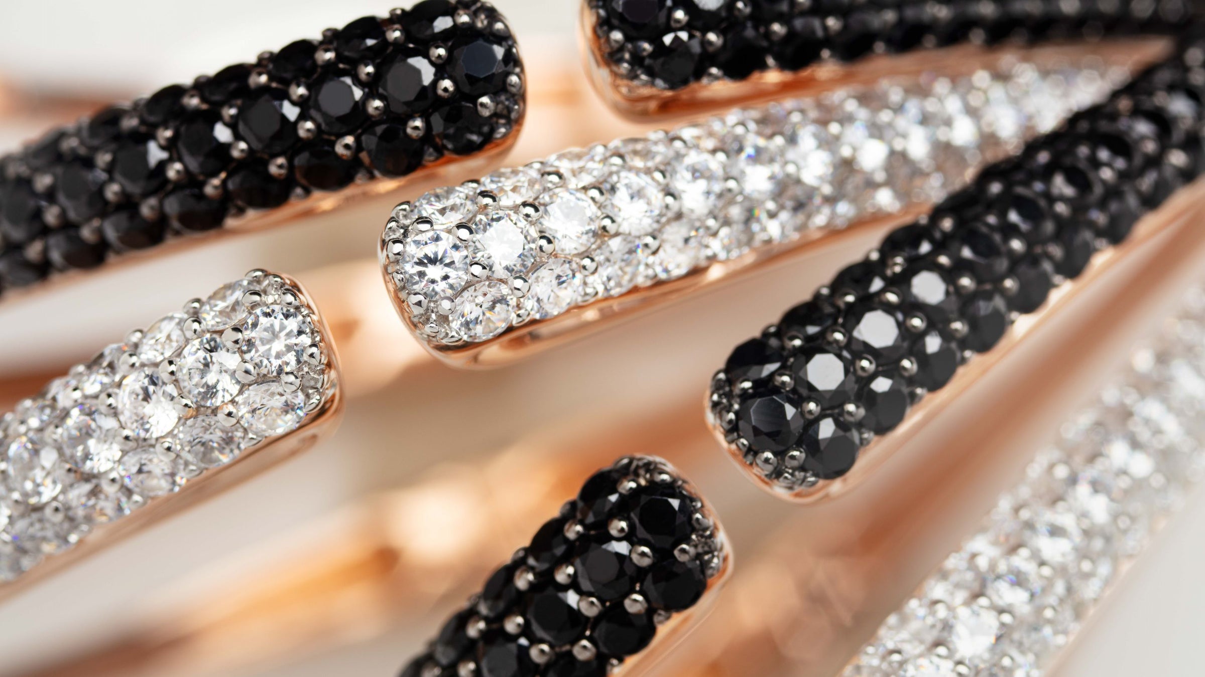 Dazzling collection of bracelets in rose gold, white cz and black cz