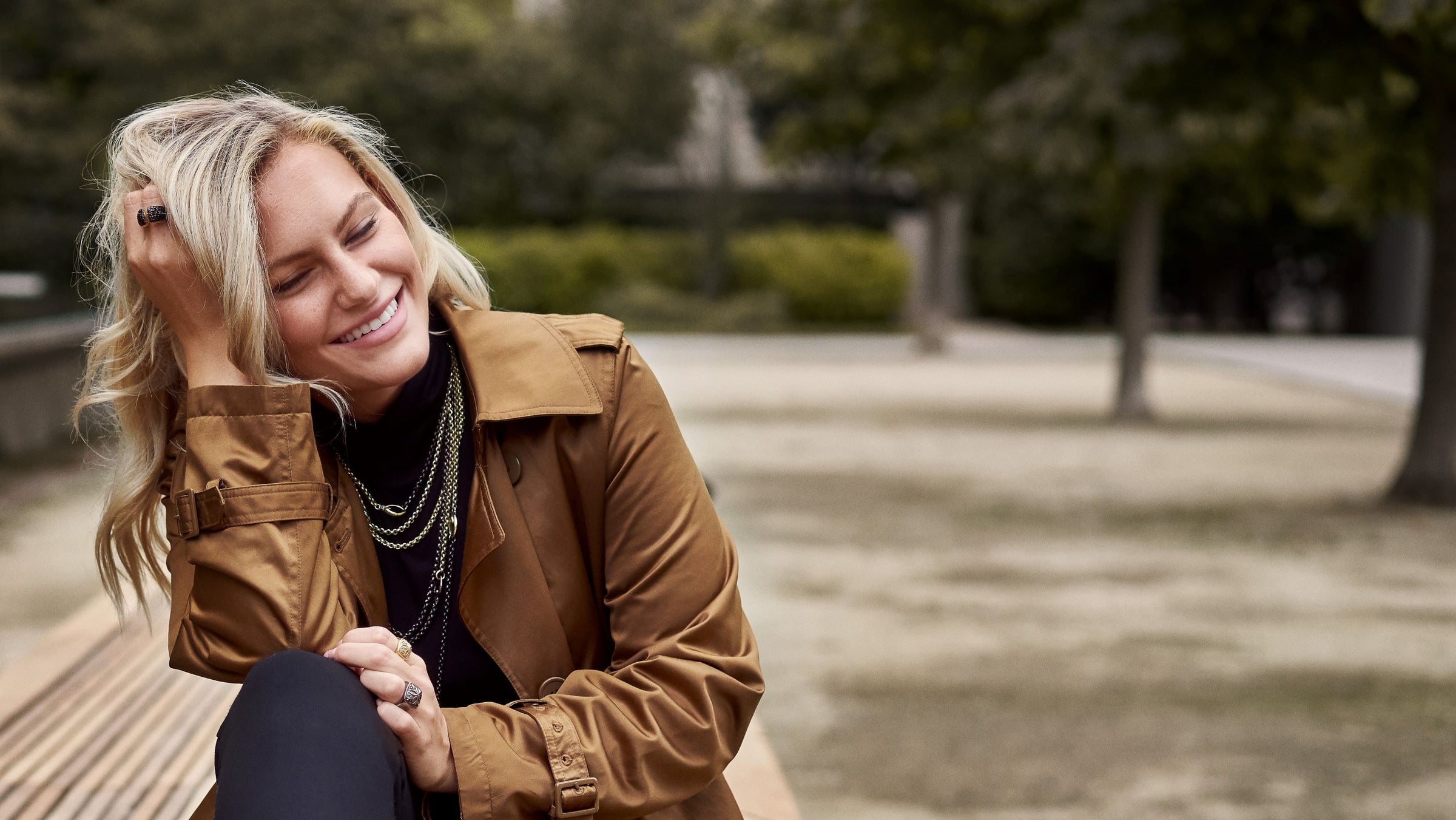 Gaby Ferret shows her Fall style outside the Barnes Museum in Philadelphia while wearing gold and black ruthenium chain necklaces from REALM
