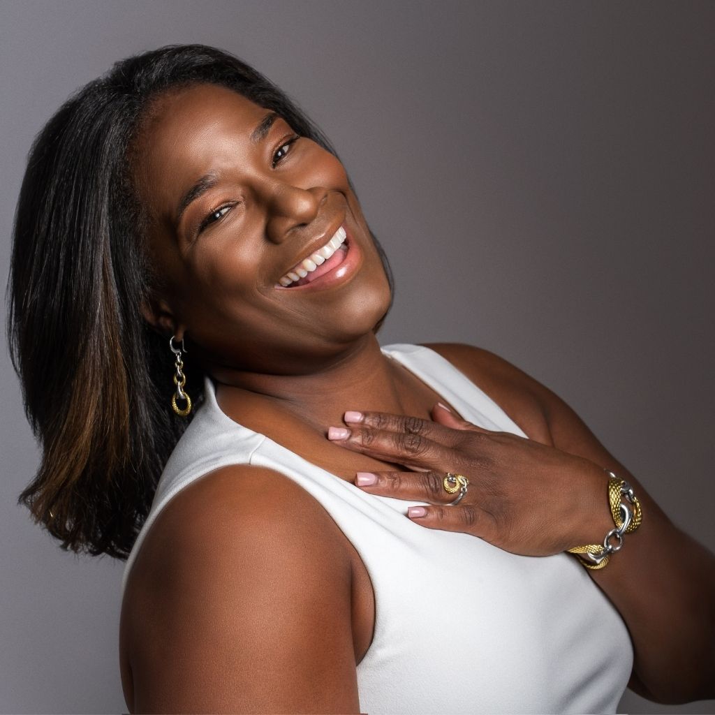 Kysha Woods wearing TRYST Collection Jewelry from REALM and white tank top