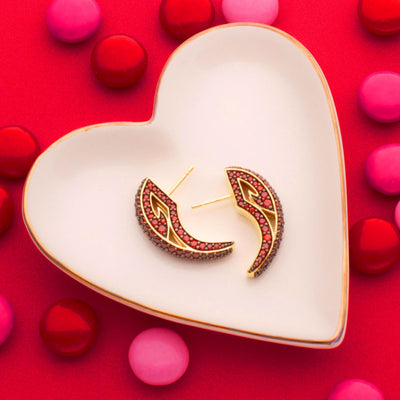 Valentine's vignette of red cz stone earrings from REALM on ivory heart tray