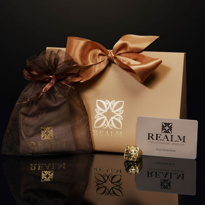 REALM Fine + Fashion Jewelry Gift Card with Sleeve  and packaging